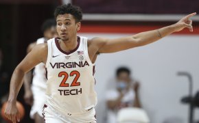 Virginia Tech's Keve Aluma points during the second half of an NCAA college basketball game against Miami