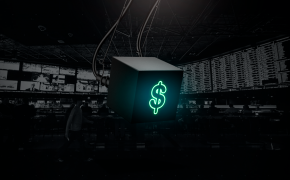 Dollar sign on black cube in a TV room
