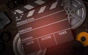 image of clapboard and equipment for a film shoot