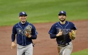 Tampa Bay Rays shortstop Willy Adames and second baseman Brandon Lowe smile as they jog off the field