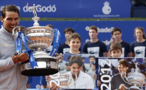 Rafael Nadal poses with trophy