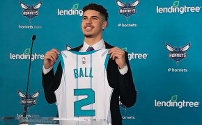LaMelo Ball holding jersey at introductory press conference