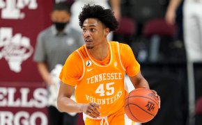 Tennessee guard Keon Johnson bringing the ball down the court during a NCAA men's basketball game.