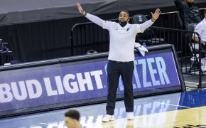 Ed Cooley arms up