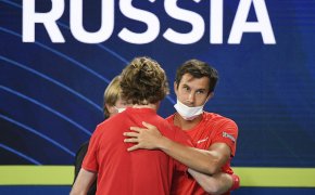 Russia's Andrey Rublev celebrating with her teammates after winning a match.