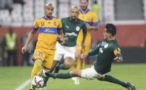 Gustavo Gomez of Brazil's Palmeiras tackling Luis Rodriguez of Tigres UANL during a soccer match.