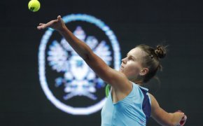 Veronika Kudermetova tossing ball to serve