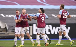 West Ham's Jarrod Bowen celebrating with his teammates after scoring a goal during a soccer match.