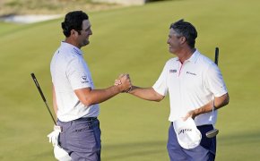 Jon Rahm shaking hands with Ryan Palmer during the third round at the Dell Technologies Match Play Championship.
