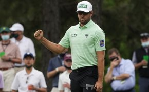 Corey Conners celebrates a birdie at the Masters