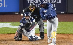 Yandy Diaz swinging at pitch