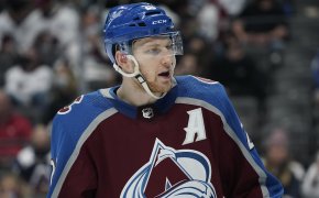 A mid shot of Colorado Avalanche center Nathan MacKinnion on the ice during a NHL playoff hockey game.