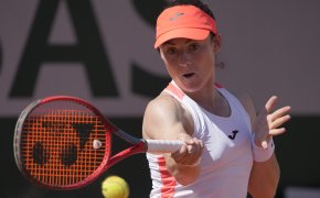 Tamara Zidansek hitting a return during a tennis match at the 2021 French Open.