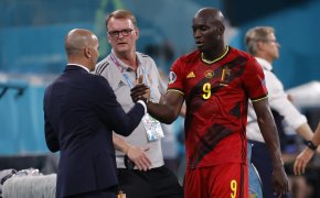 Belgium manager Roberto Martinez greets Romelu Lukaku