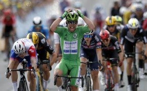 Mark Cavendish celebrates after winning a sprint finish at the 2021 Tour de France