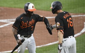 Orioles players celebrate after run scored