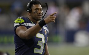 Russell Wilson gestures from sideline