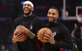 Carmelo Anthony and Damian Lillard in warmups laughing