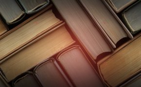 close up image of books stacked on top of each other