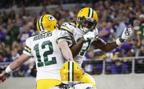 Aaron Rodgers and Davante Adams leaping celebration