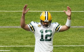 Aaron Rodgers arms up in TD signal