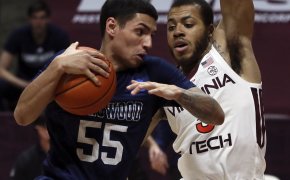 Longwood's Juan Munoz trying to force his way past a Virginia Tech defender