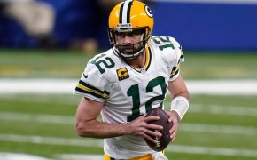 Aaron Rodgers rolls out looking to throw