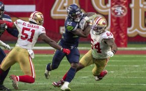 Seattle Seahawks running back Chris Carson carrying the ball against the San Francisco 49ers.