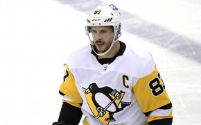 A mid shot of Sidney Crosby on the ice during a hockey game.