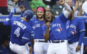 Toronto Blue Jays' George Springer, Vlad Guerrero Jr, Bo Bichette celebrate a home run