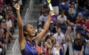 Leylah Fernandez reacting with her hands up in the air after winning a tennis match at the US Open.