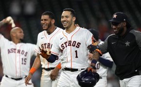 Houston Astros' Carlos Correa celebrating a game-winning hit in extra innings