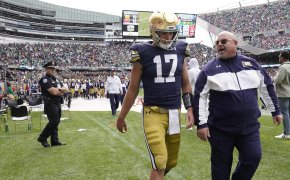 Notre Dame quarterback Jack Coan making his way to the locker room after an injury during a college football game.