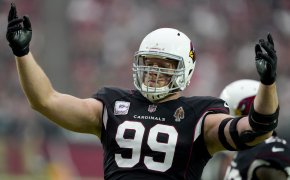 Arizona Cardinals defensive end J.J. Watt with his hands in the air during an NFL football game.