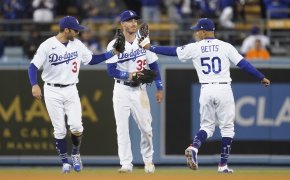 Los Angeles Dodgers' Chris Taylor, Cody Bellinger, and Mookie Betts celebrating a win