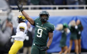 Michigan State player Kenneth Walk III celebrating after scoring a touchdown.