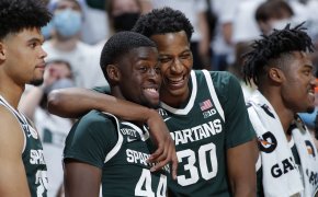 Michigan State's Gabe Brown and Marcus Bingham Jr laughing on the court