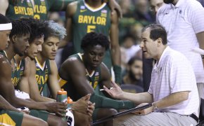 Baylor head coach Scott Drew talking to his team on the bench