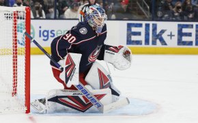 Columbus Blue Jackets' Elvis Merzlikins looking to block a shot during a game.