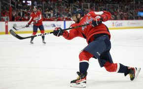 Alexander Ovechkin following through on a shot during an NHL hockey game.