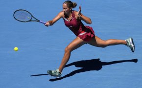 Madison Keys stretching for a forehand during a match at the Australian Open.
