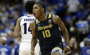 Marquette forward Justin Lewis celebrates after making a three