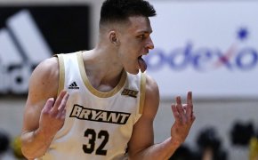 Bryant guard Peter Kiss celebrates after making a three
