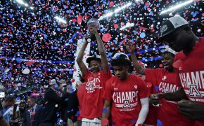 Arizona players celebrate winning the 2022 Pac-12 Tournament