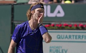 Andrey Rublev covering his face after losing a point