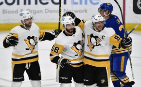 Penguins players celebrate goal