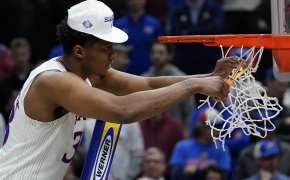 Kansas' David McCormack cutting down the nets after his team advanced to the Final Four