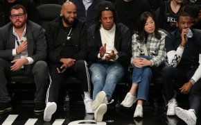 jay z sitting courtside at a basketball game