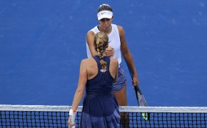 Madison Keys (top) shakes hands with Petra Kvitova (bottom).