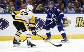Tampa Bay Lightning center Steven Stamkos skates with the puck against Pittsburgh Penguins right wing Bryan Rust